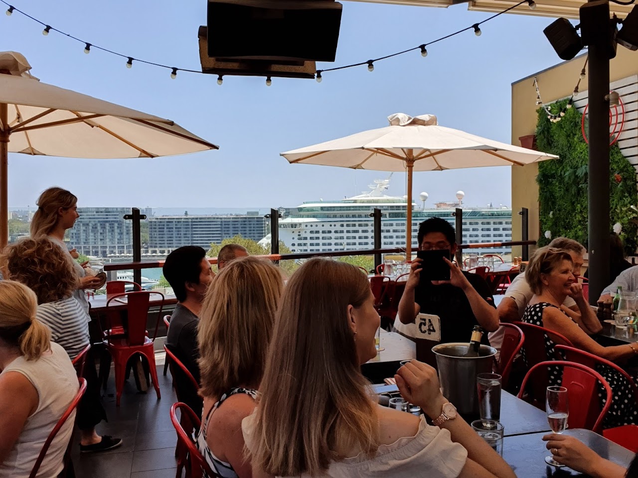 Guests seated on The Glenmore Hotel rooftop