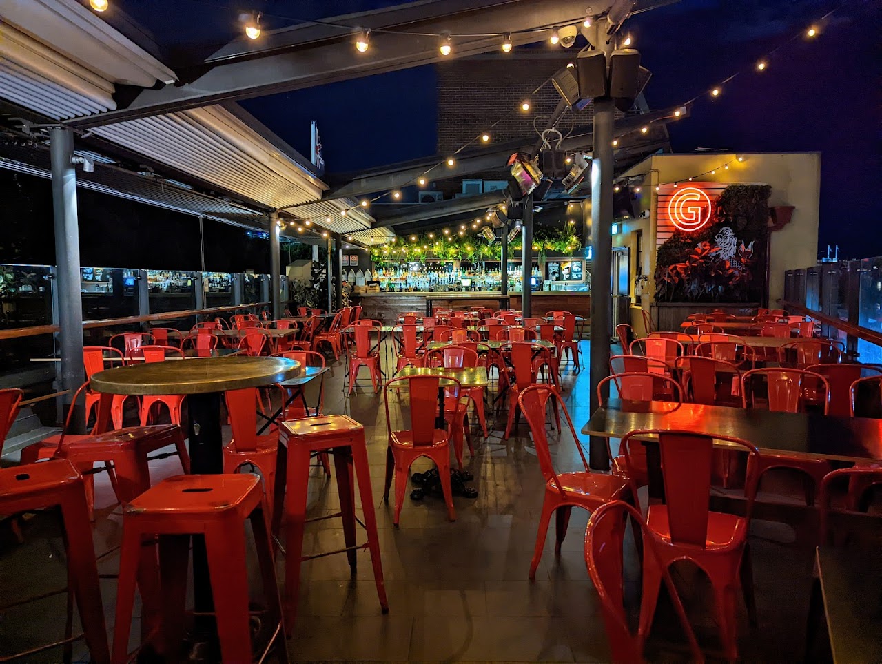 The Glenmore Hotel rooftop bar at night